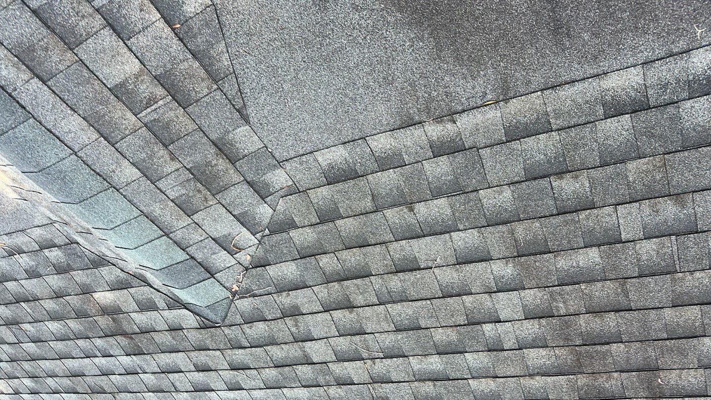 Close-up of a newly installed asphalt shingle roof.