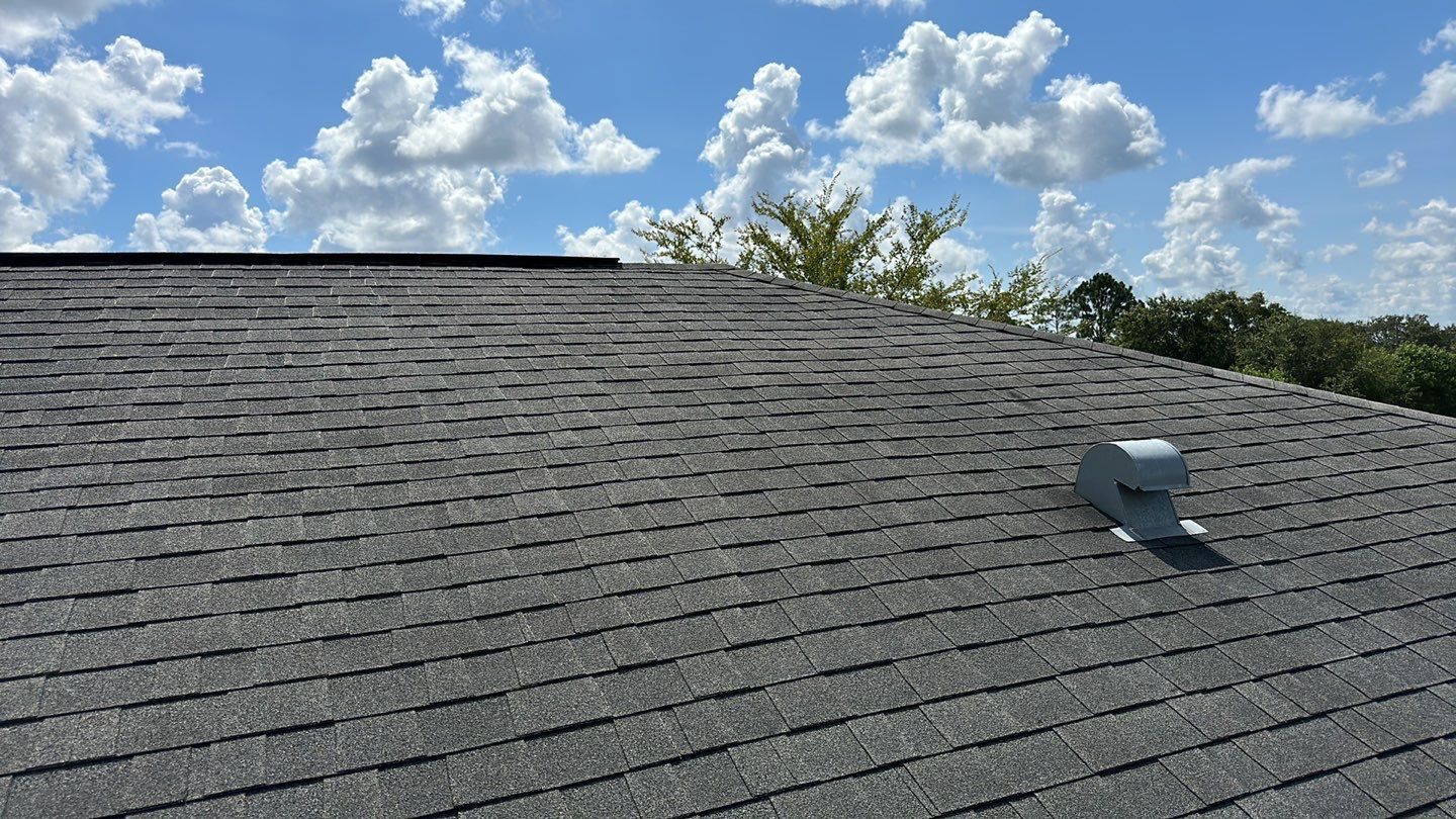 Close-up of a newly installed asphalt shingle roof.