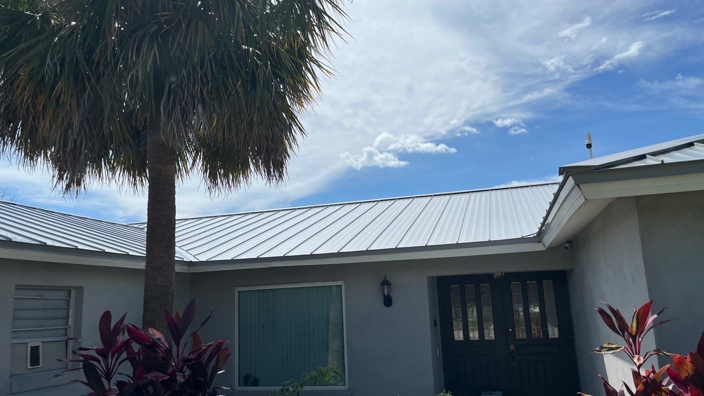 Completed metal roof on a residential property showcasing its sleek design. 