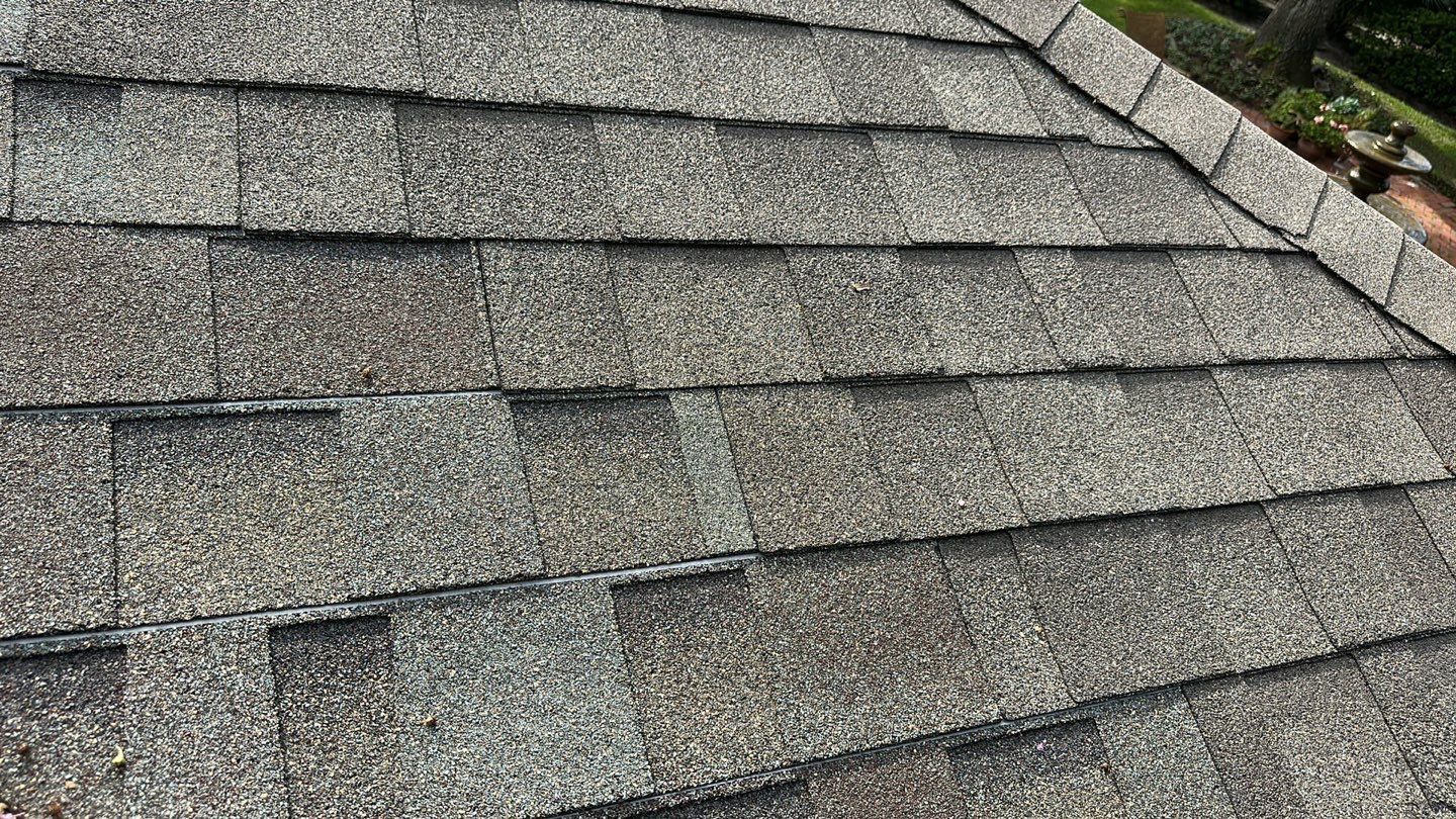 Close-up of a newly installed asphalt shingle roof.