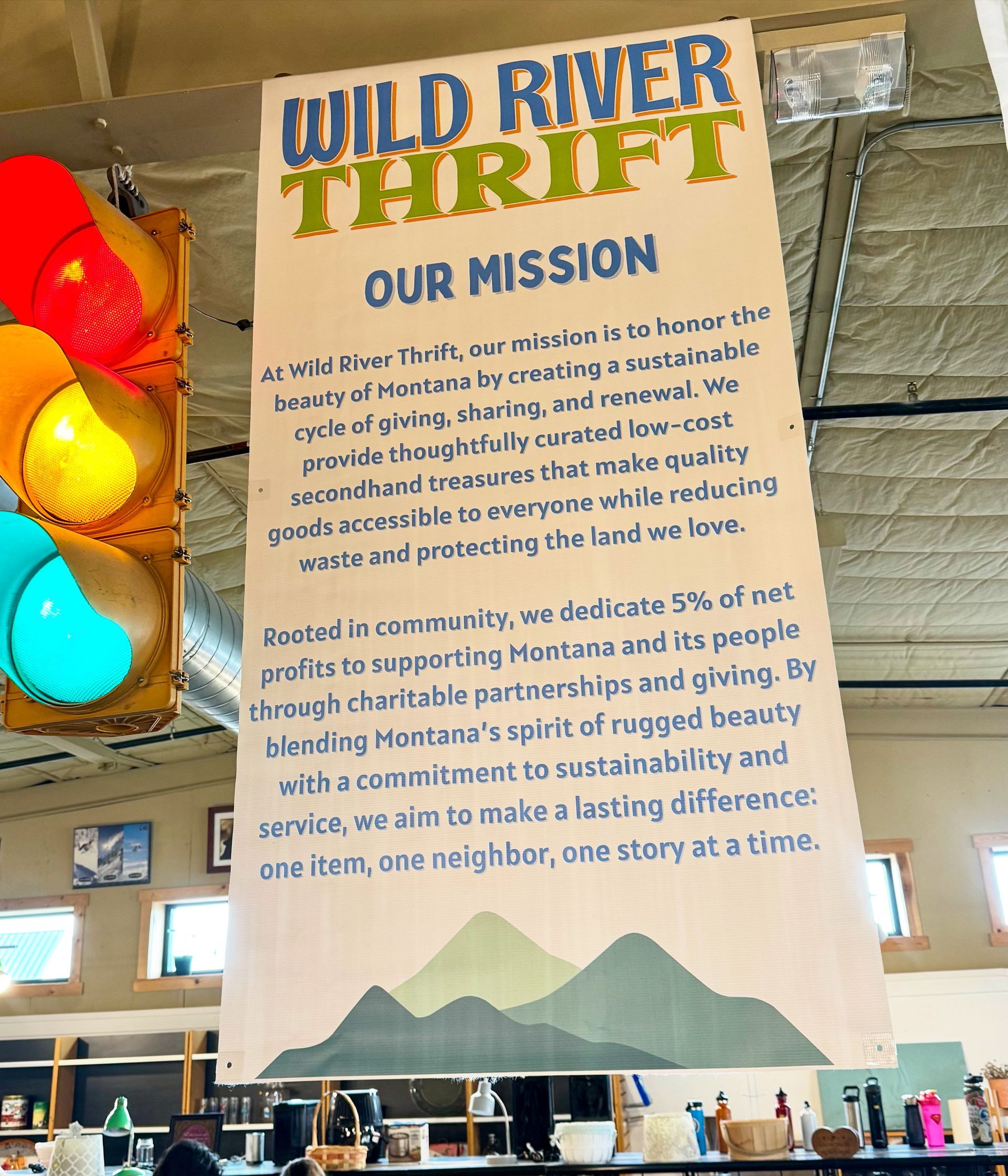 Banner for Wild River Thrift store, describing their mission and commitment to community and sustainability.