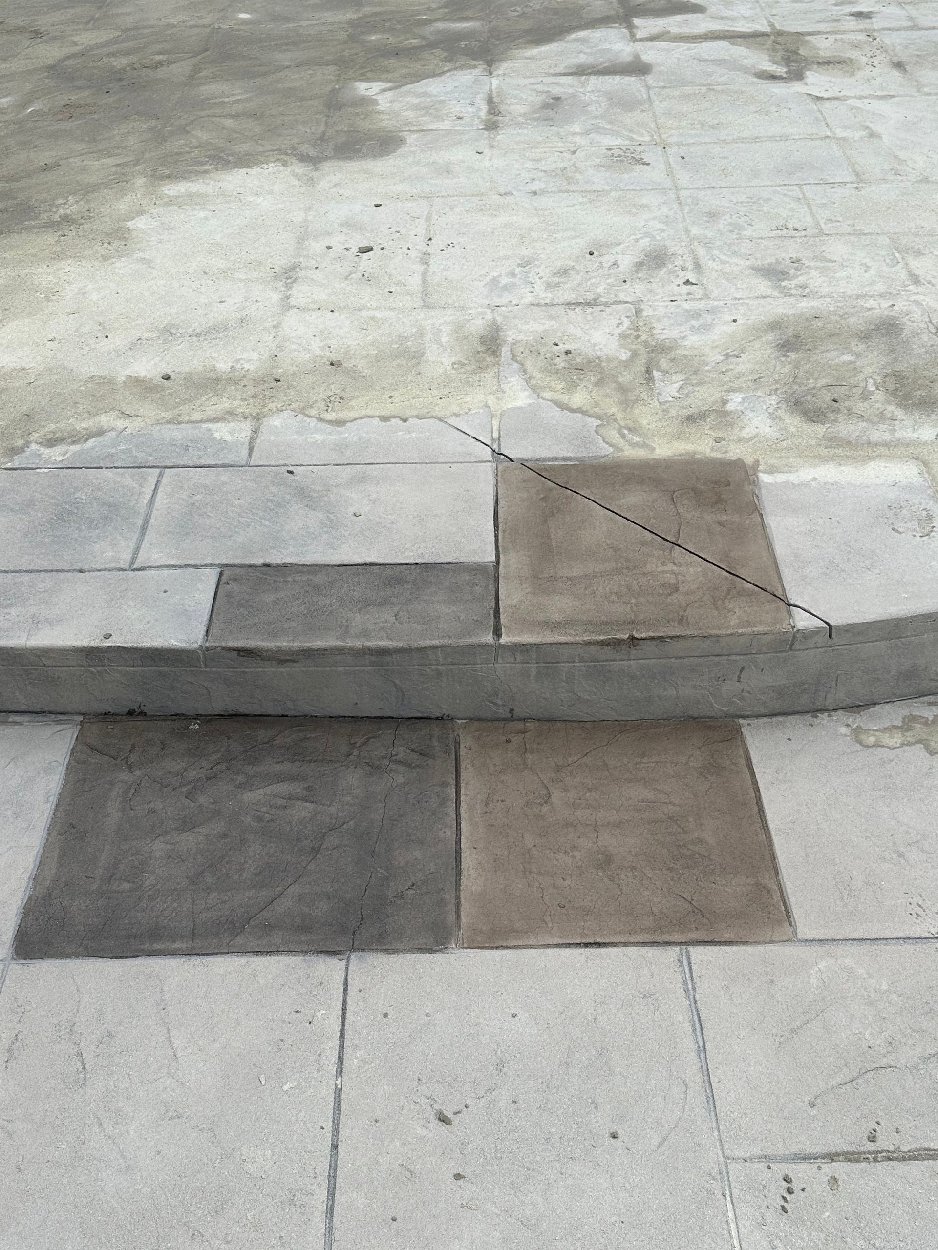 Stone steps with various shades of gray and brown tiles.