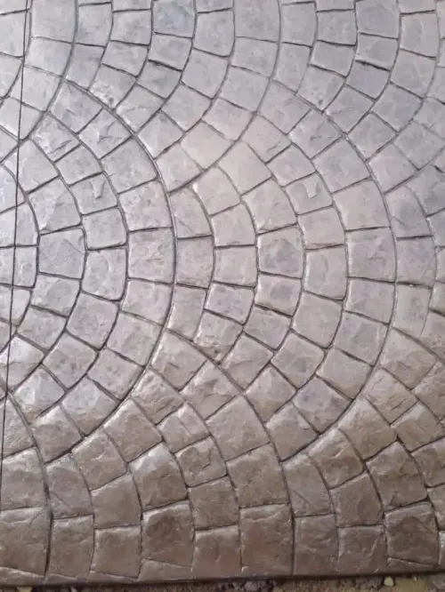 A close up of a circular pattern on a concrete floor.