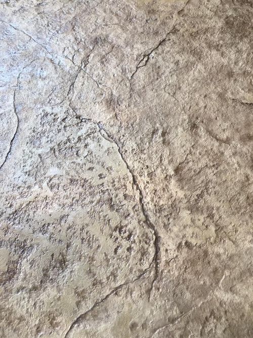 A close up of a concrete floor with a texture of a rock.