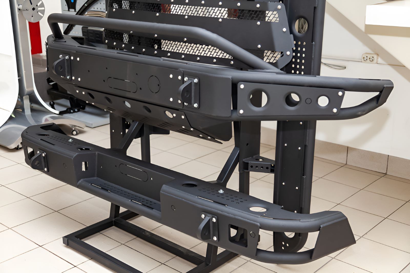 A Black Bumper Is Sitting On A Stand — All Models Service Centre In Port Macquarie, NSW