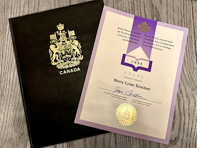 Folder with emblem of Canada and signed certificate