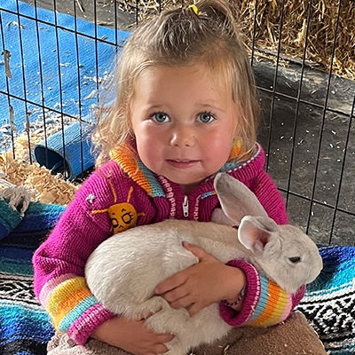 young girl holding a bunny