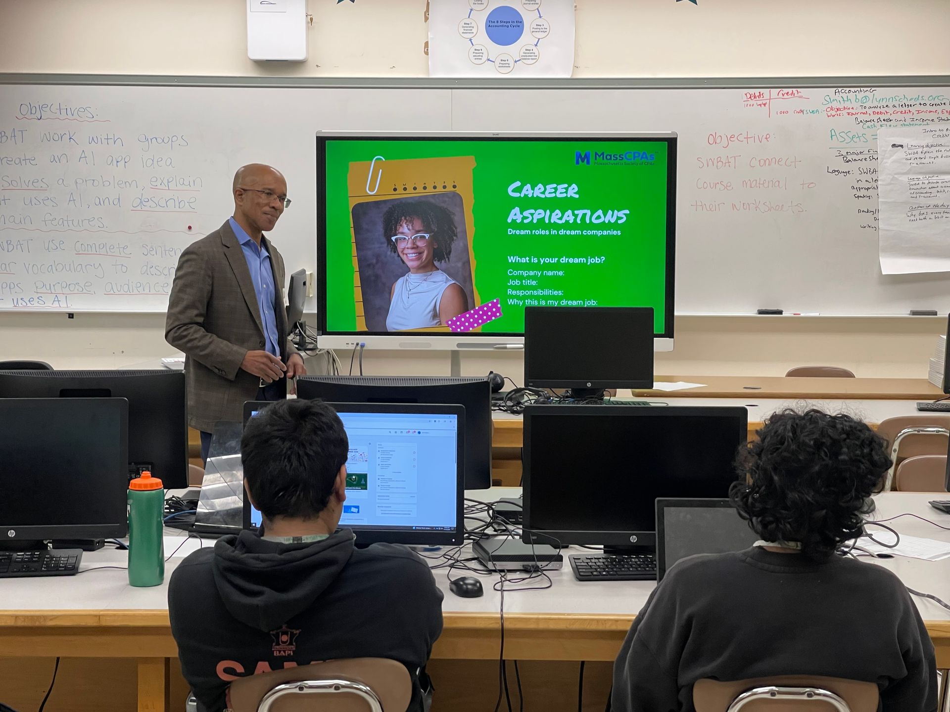 Rob Miller talks with high school seniors at Lynn Classical High School about the accounting profession.