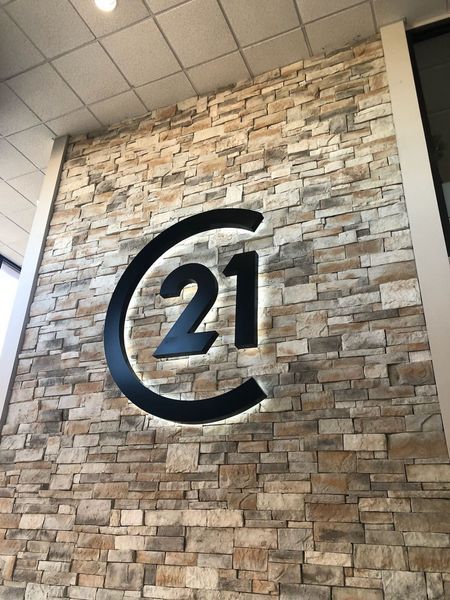 A Brick Wall With the Number 21 on It