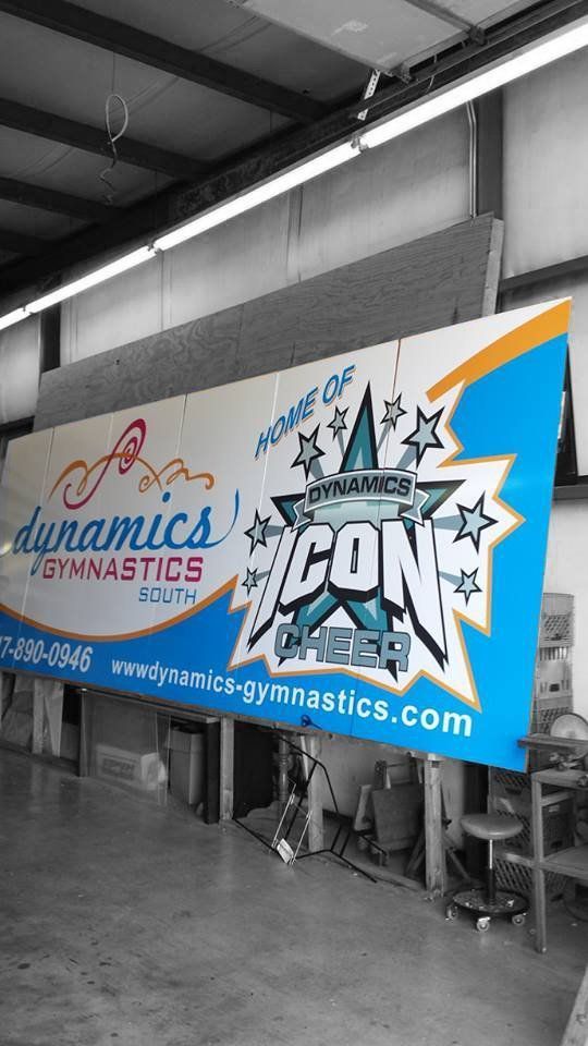 A Large Blue and White Sign for Dynamics Gymnastics