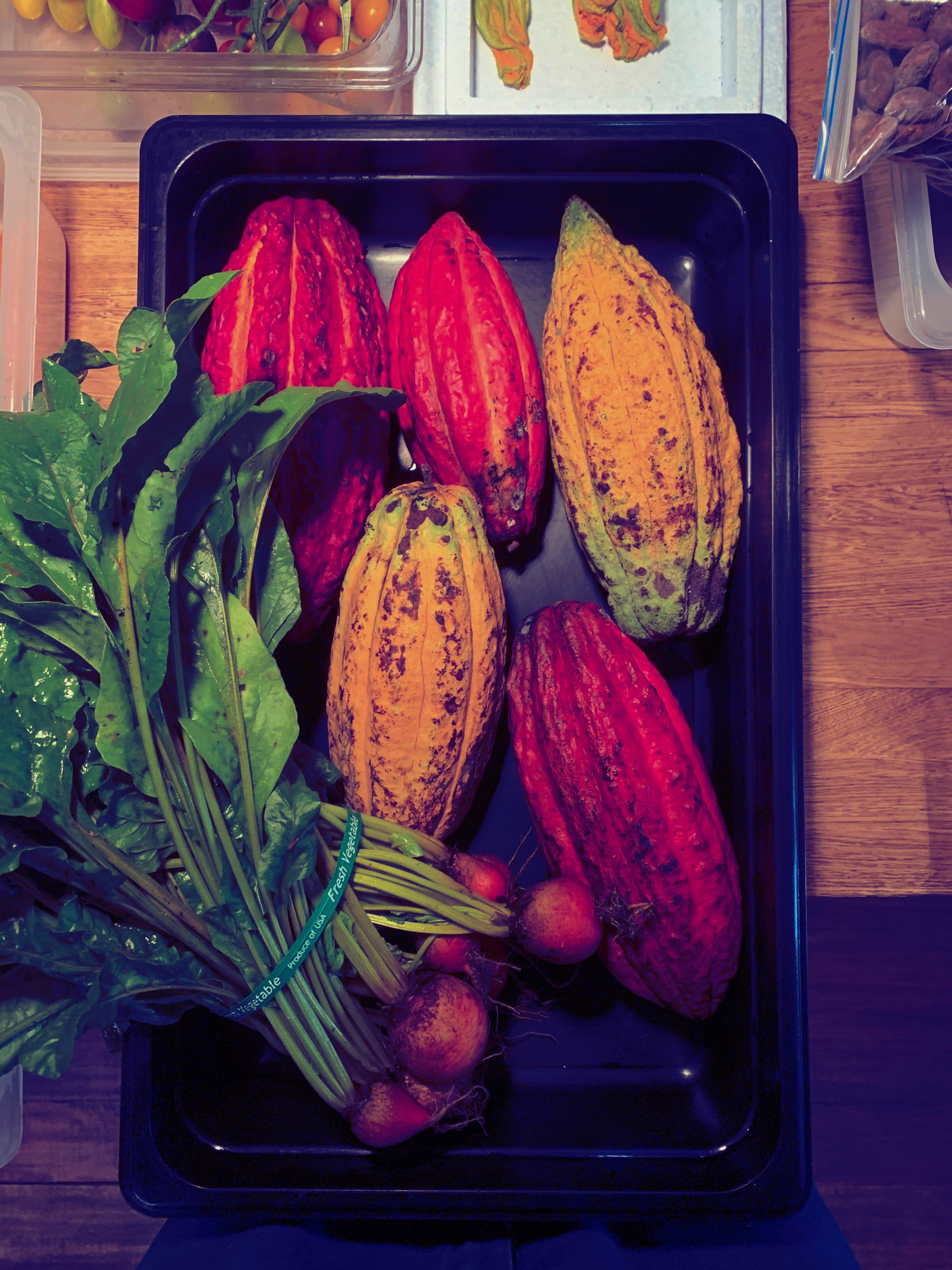 A tray of fruits and vegetables on a table