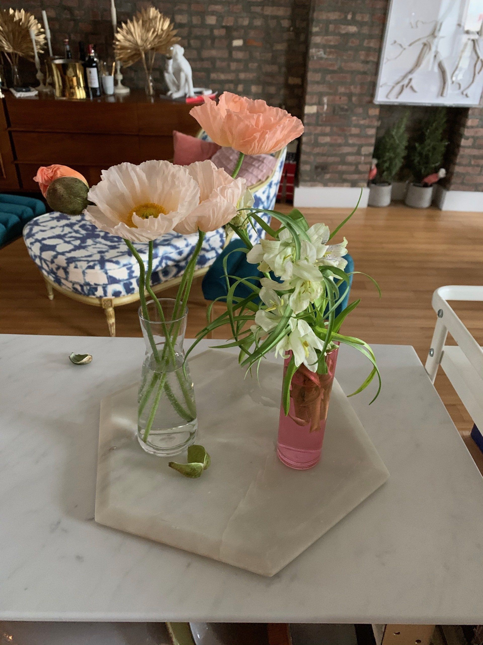 Flowers in vases on a table in a living room