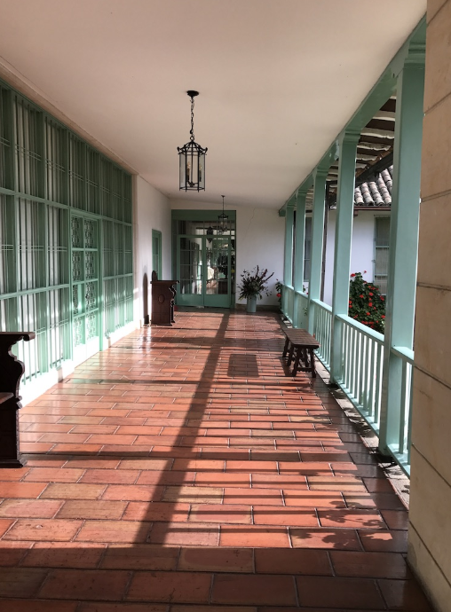 A long hallway with a lantern hanging from the ceiling