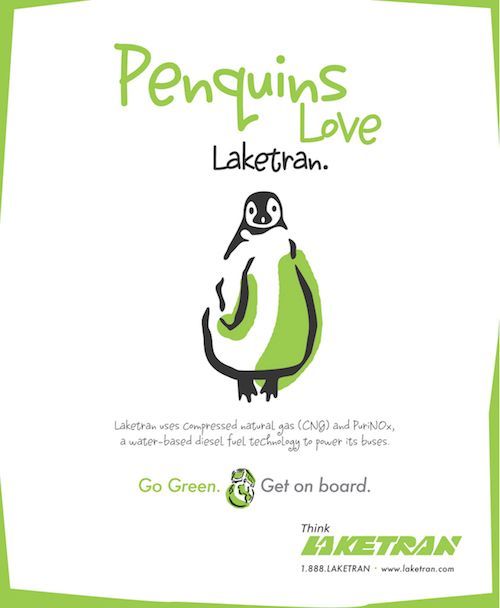 Penguin-themed LakeTran ad with green text and a penguin in a green vehicle shape saying “Go Green. Get on board.”