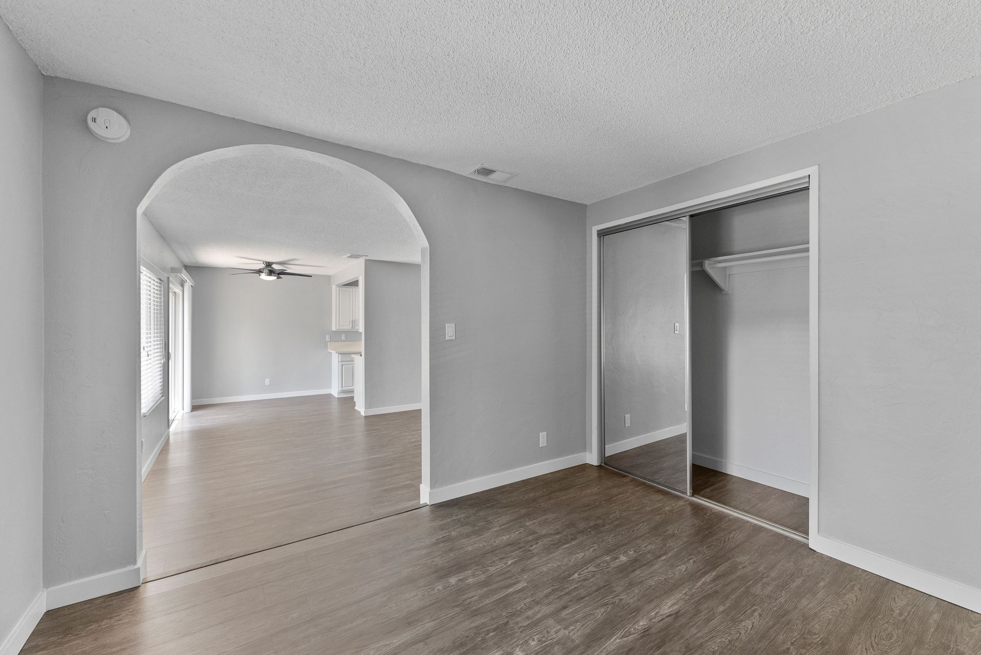 The Jackson apartment living area with arch to  bedroom