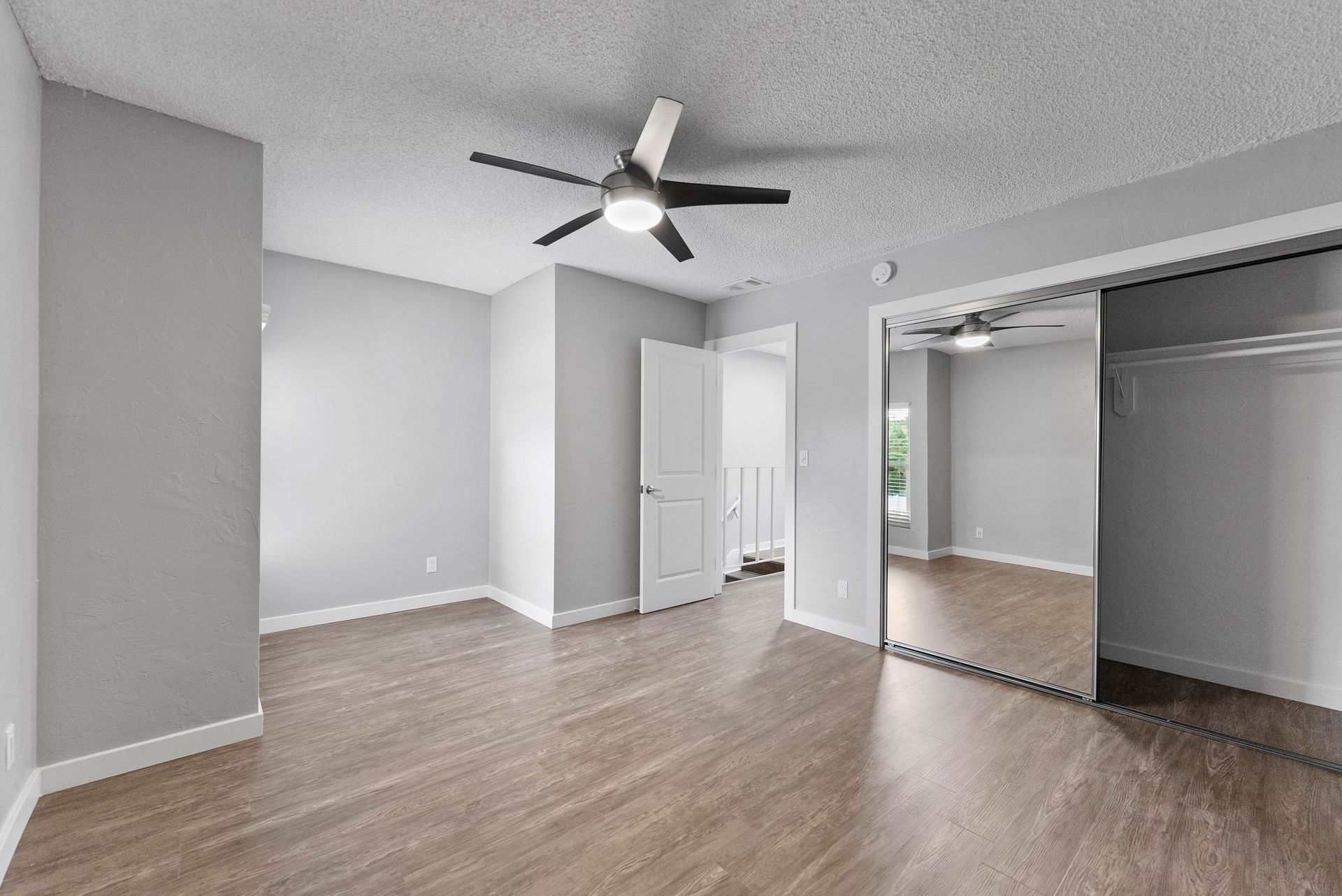 The Jackson apartment bed room with closet and fan