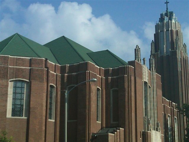 Durable green clay tile roof installed by Kreiling at Trinity Church in Bloomington, IL
