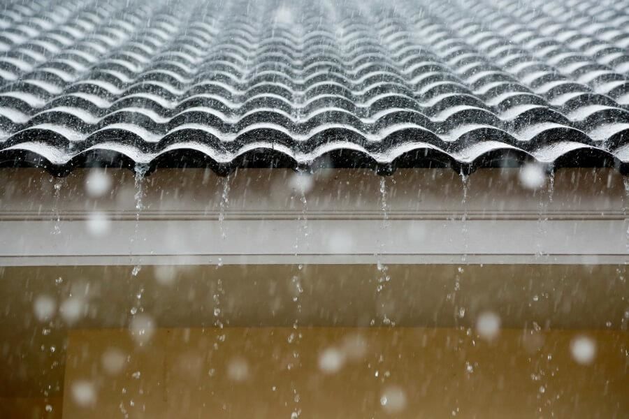 Rain storm on metal tile roof
