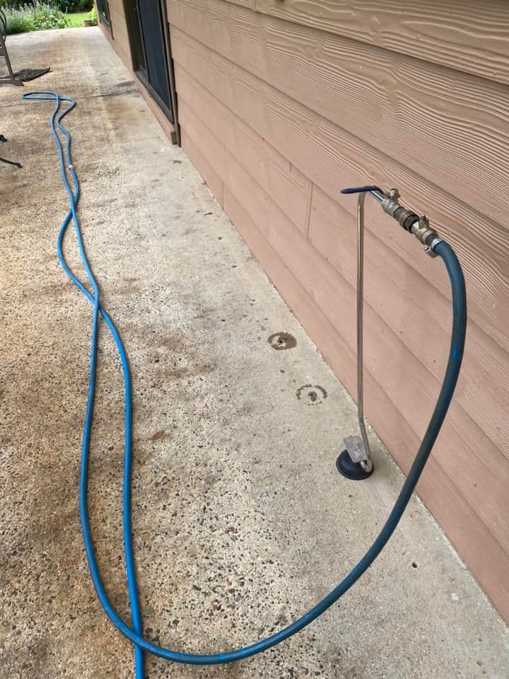 A Reticulation pump attached outside a house— Allied Pest Management Northern Rivers in Tregeagle, NSW