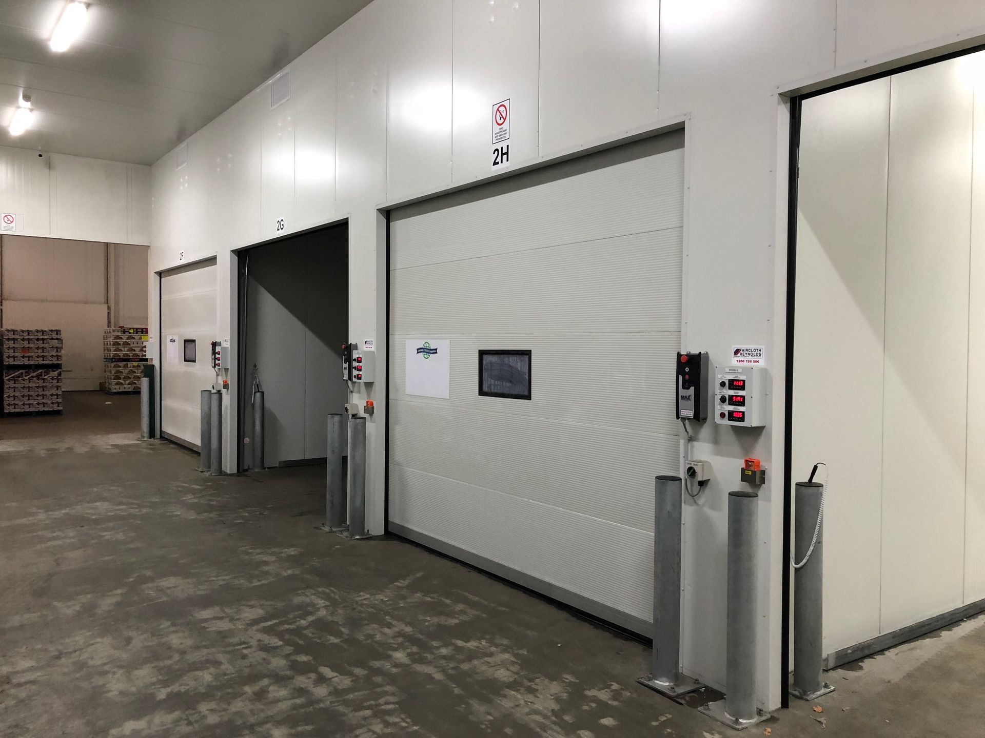 A warehouse with a lot of white walls and doors.