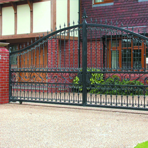 Dark green steel double driveway gates with curved tops