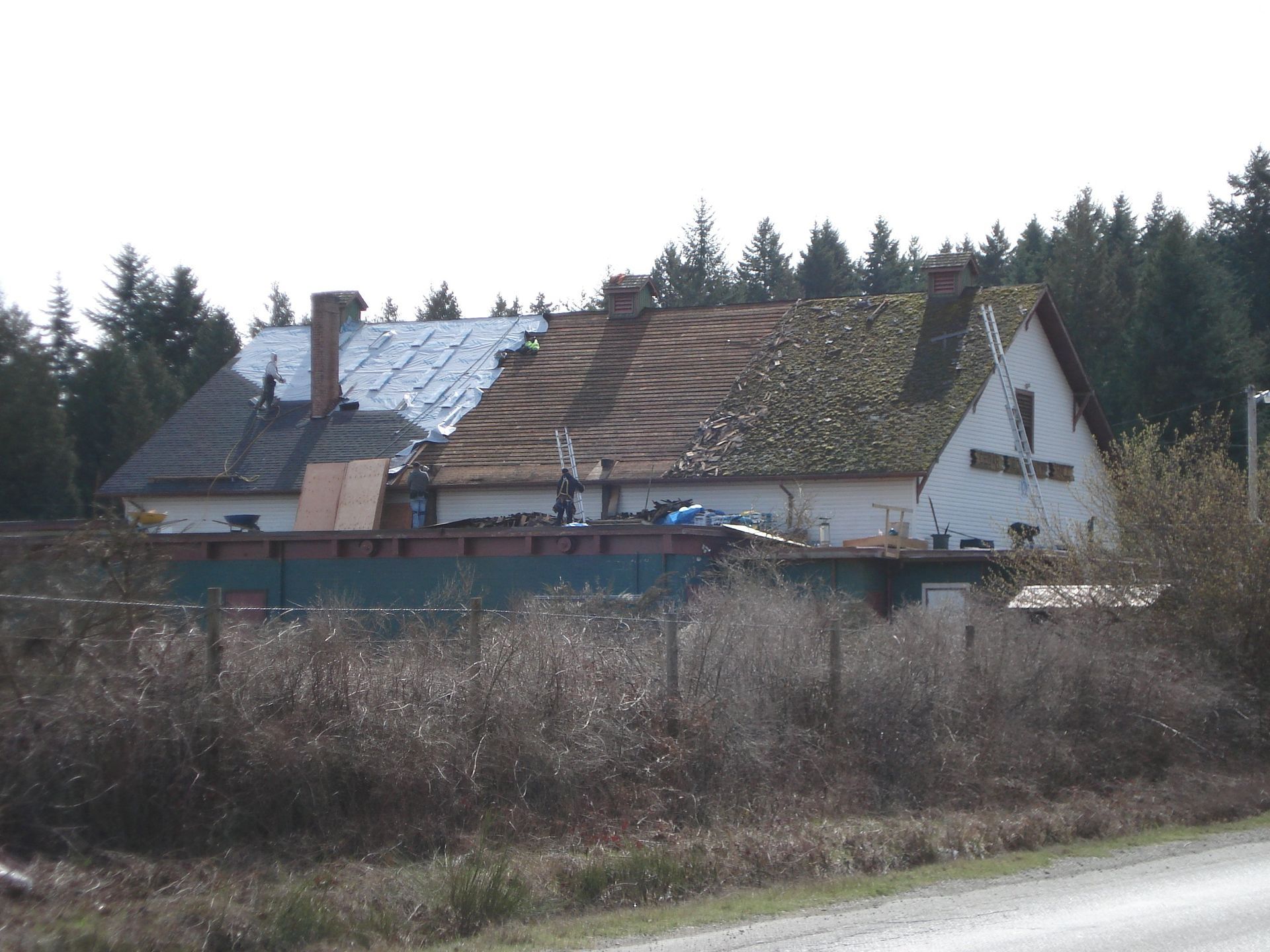 A house with a roof that is being repaired