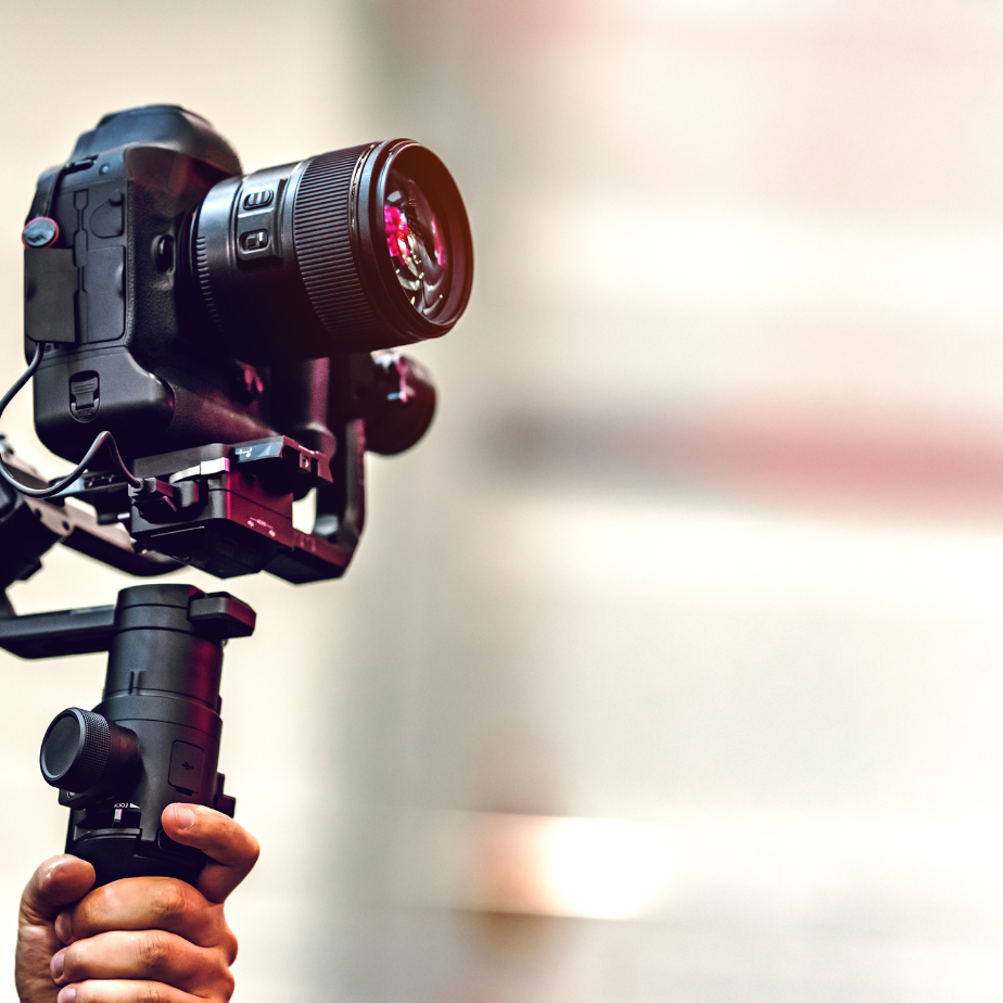 A person is holding a camera on a gimbal.