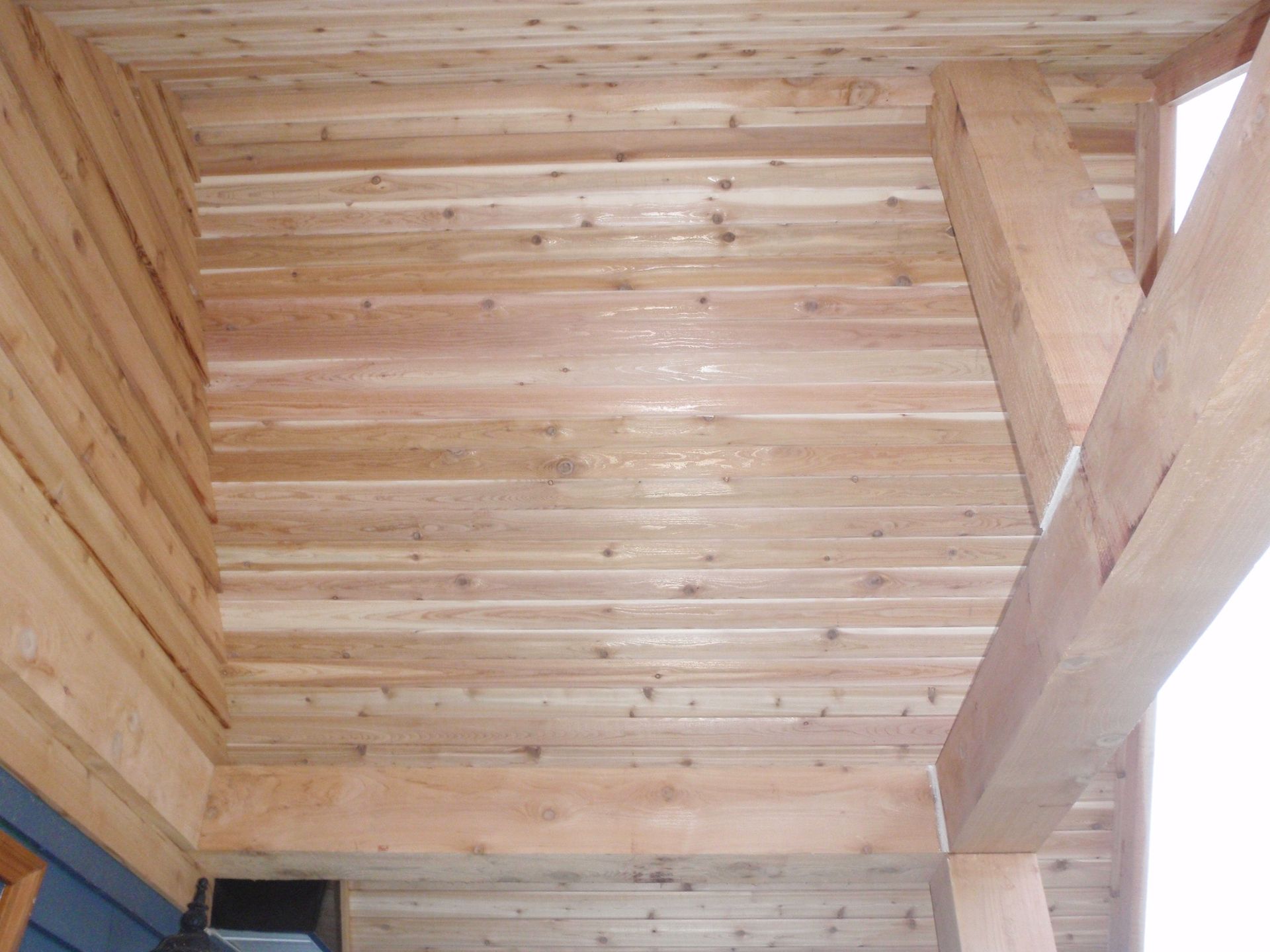 The ceiling of a house is made of wood