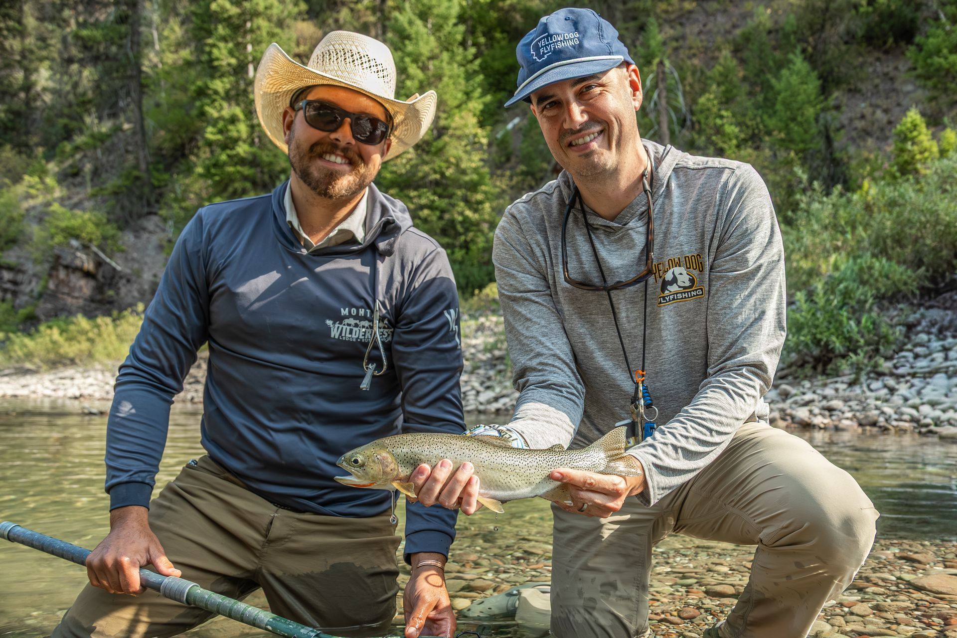 two men holding antlers of elk they have downed