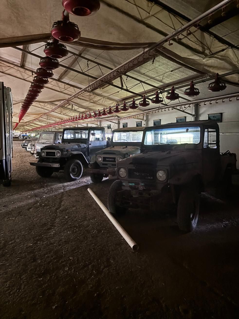 A Row Of Old Jeep's Are Parked In A Garage — Byron Storage Services In Myocum, NSW