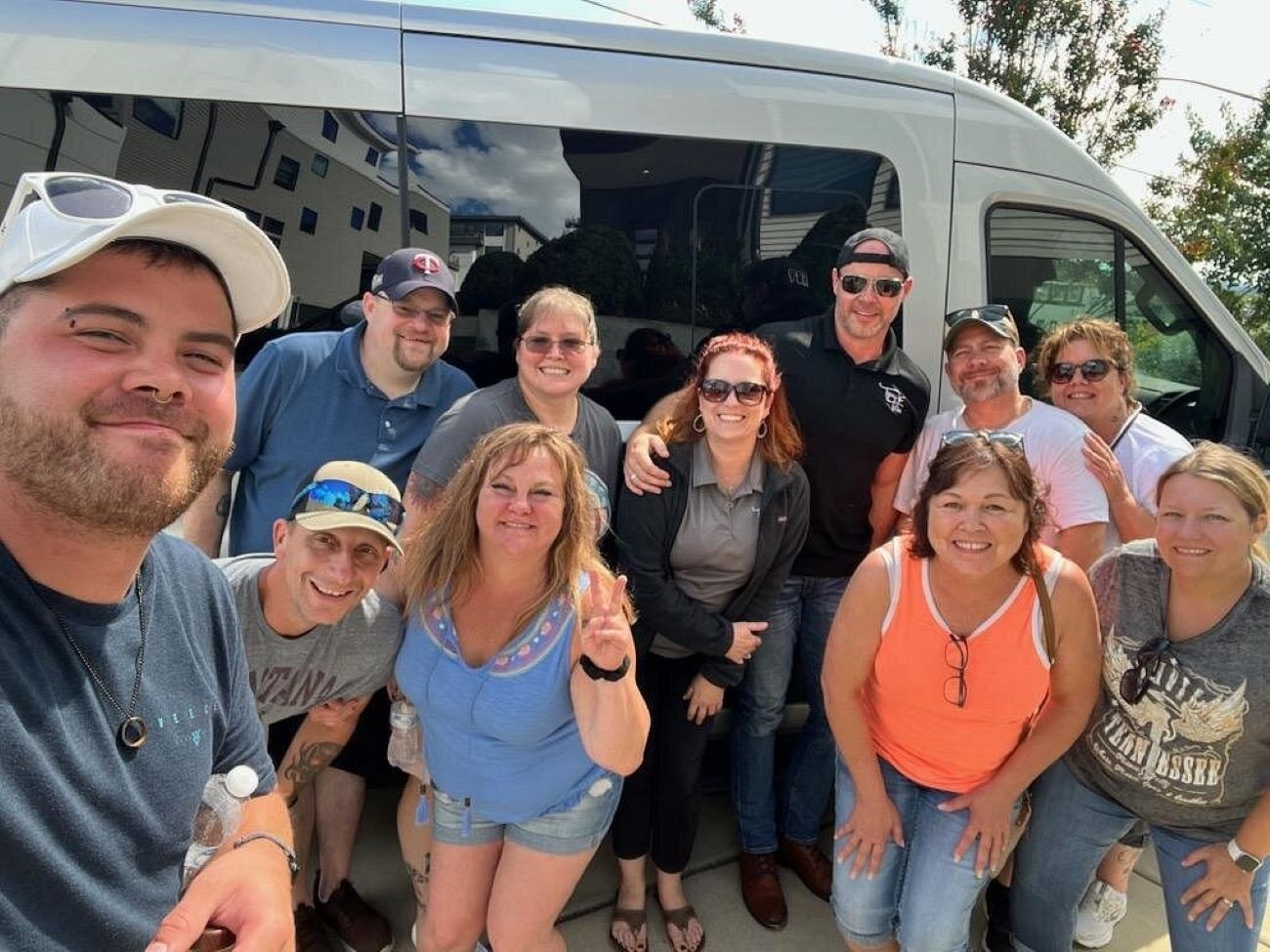 Happy Tipsy Tours group on party bus to Jack Daniel’s Distillery from Nashville