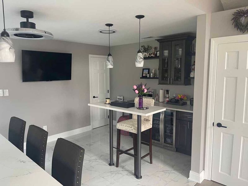Kitchen renovation with gray walls.