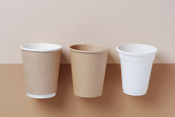 Three different types of coffee cups are sitting next to each other on a table.