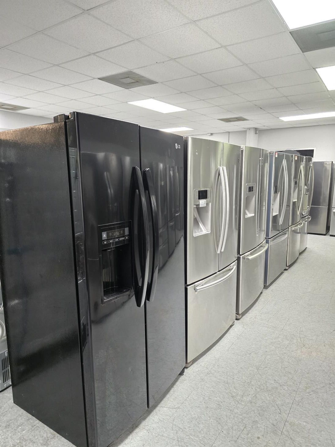 A kitchen with a stove , microwave , sink and dishwasher.