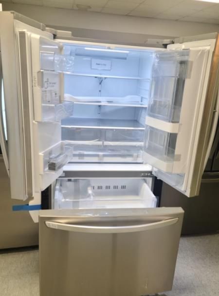 A kitchen with a stove , microwave , sink and dishwasher.