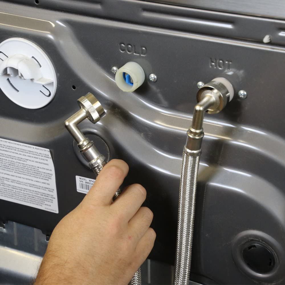 A kitchen with a stove , microwave , sink and dishwasher.