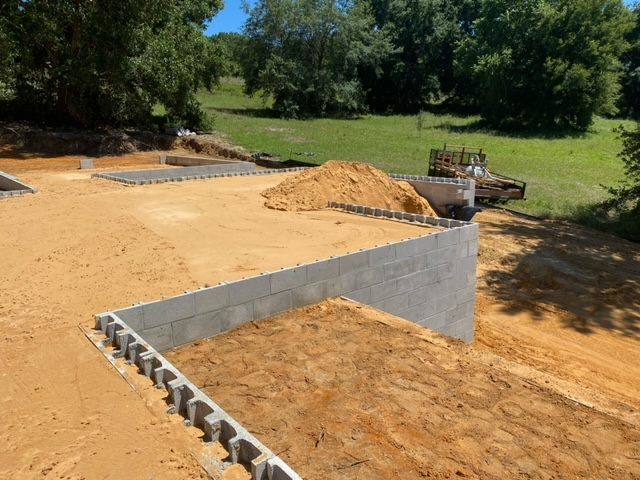 A large pile of dirt is sitting on top of a dirt field.