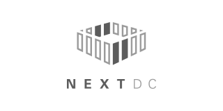 The NEXTDC logo, featuring a grey, isometric cube structure made of vertical bars above the text "NEXTDC" in grey.