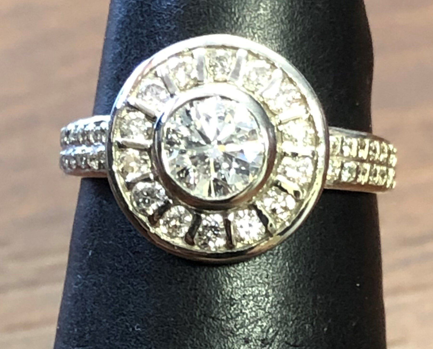 A gold ring with a diamond in the center
