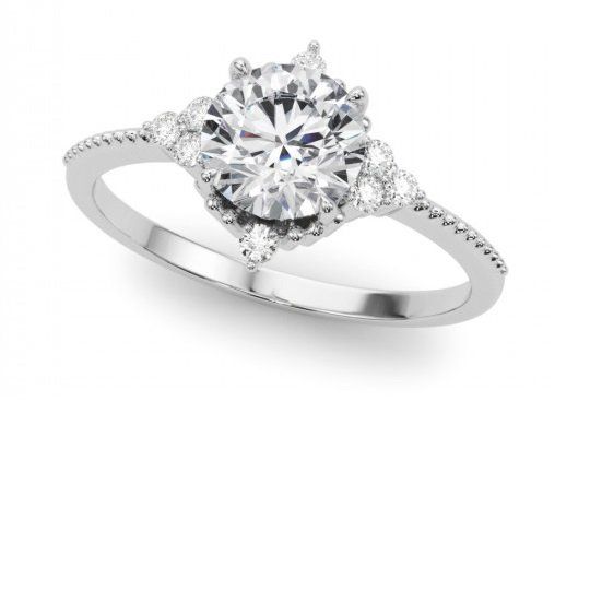 A white gold ring with a diamond in the center