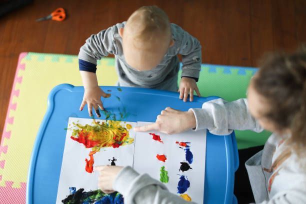 Baby Boy Playing With Paint — Register, GA — Bright Minds Playhouse