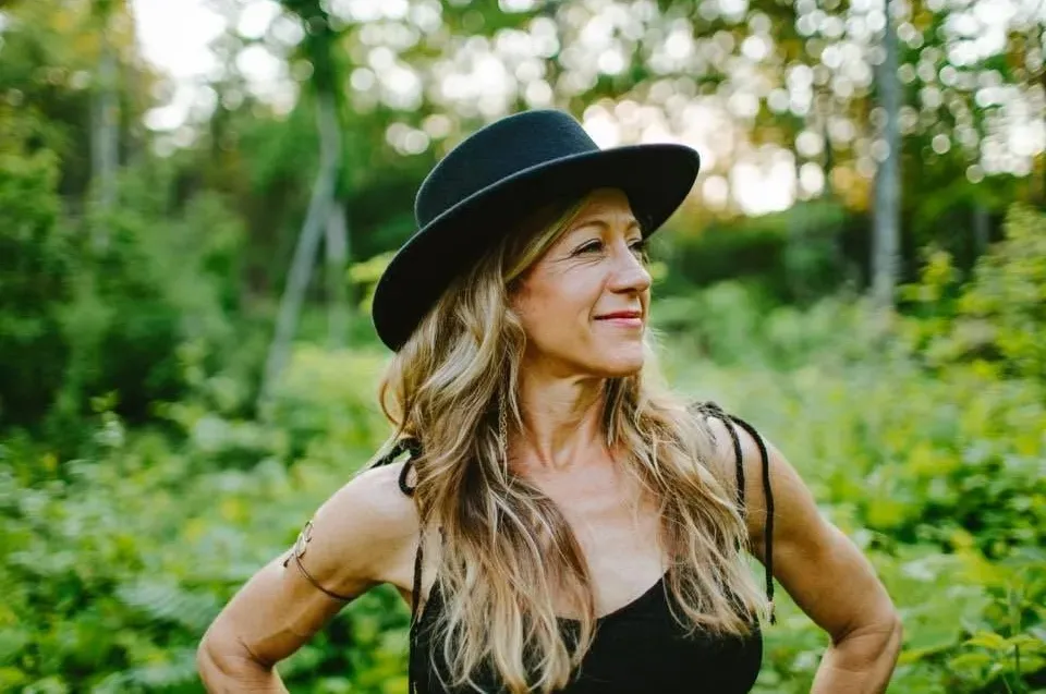 CEO and Founder of Franny's Farmacy Franny Tacy harvesting a bushel of hemp flower