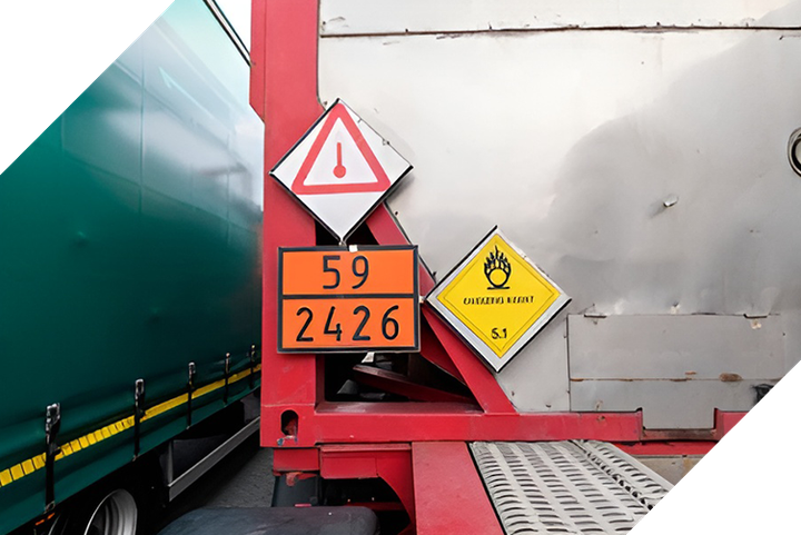 hazardous waste signs on the back of a truck