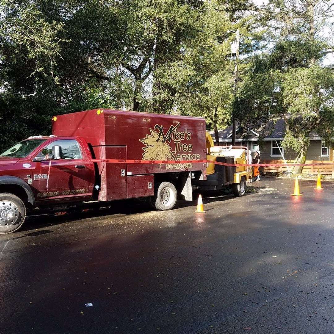 A red truck is parked on the side of the road A red truck is parked on the side of the road