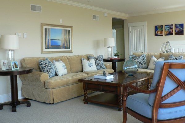 A living room with a couch a chair and a coffee table