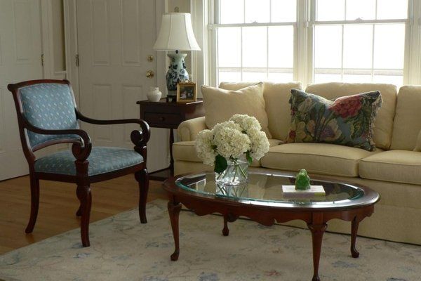 A living room with a couch a chair and a coffee table