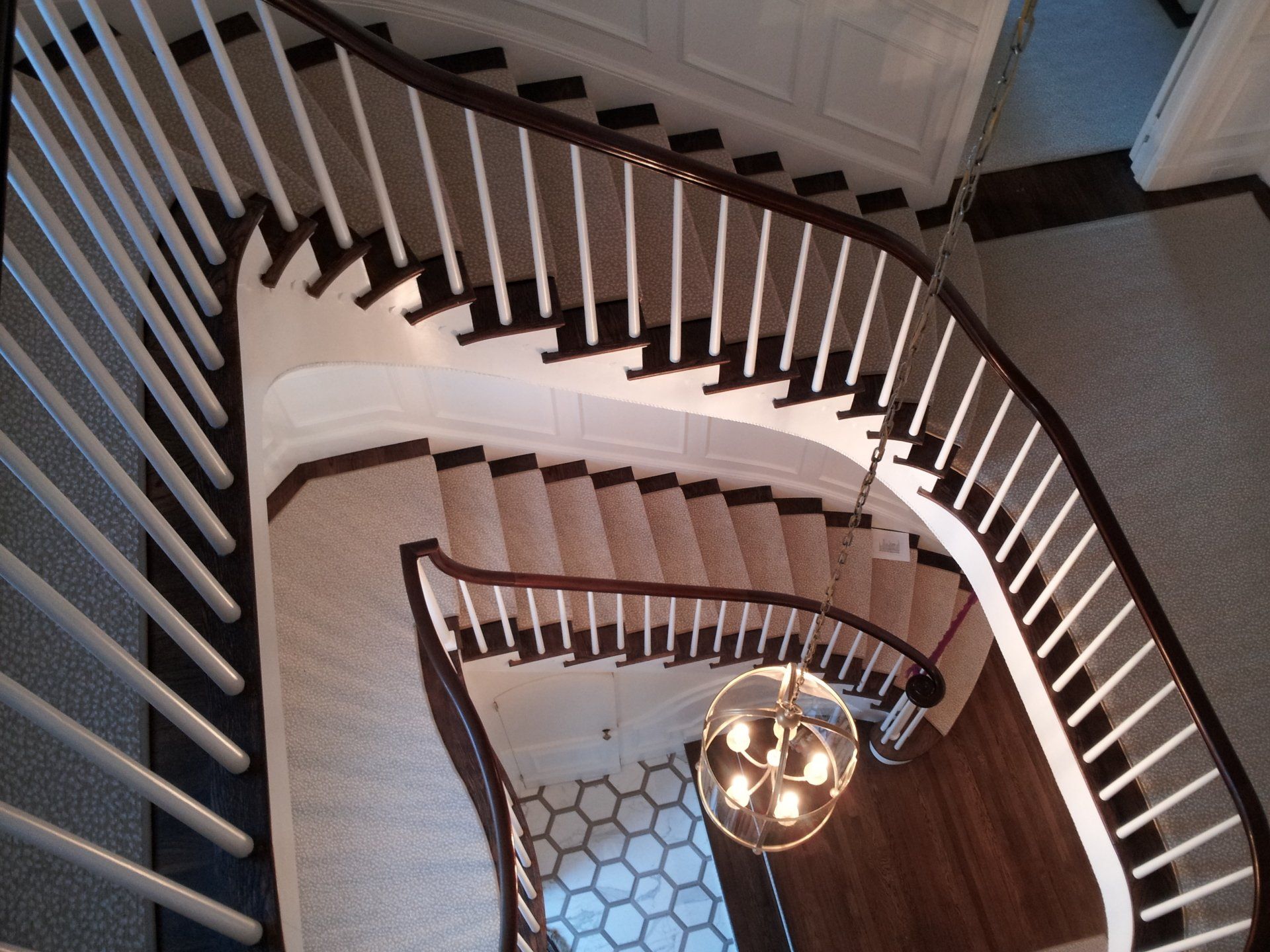 An aerial view of a spiral staircase in a house