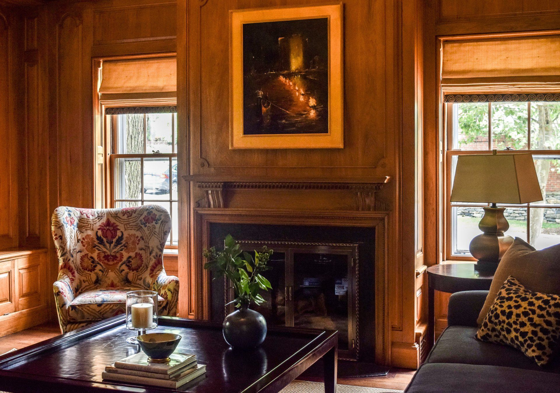 A living room with a couch a chair and a fireplace