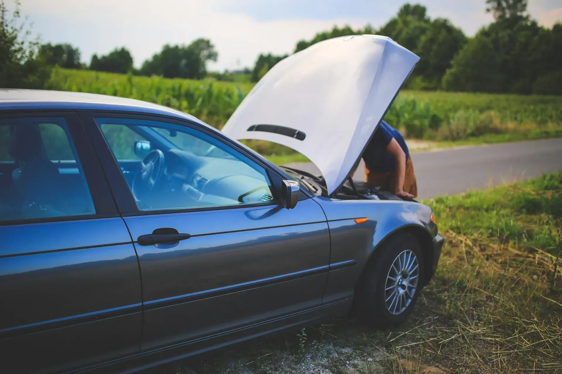 Man Checking His Car Engine — Ridgehaven, SA — Modbury Battery Service Pty Ltd