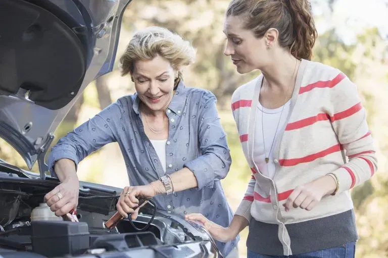 Two Woman Checking Car Battery — Ridgehaven, SA — Modbury Battery Service Pty Ltd